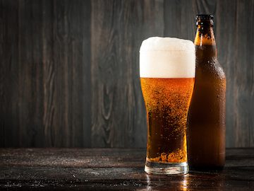 Glass of beer and beer bottle